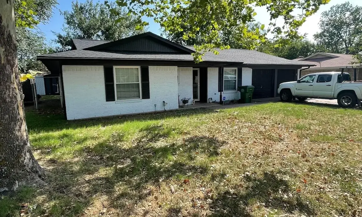 Professional roofing crew working on a residential roof in Round Lake